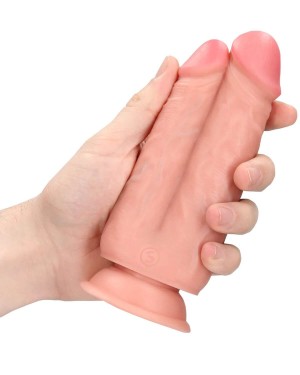 dildo réaliste à ventouse double pénétration, RealRock, dans une main