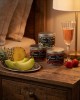 Présentation des trois senteurs de bougies disponibles, tropical, vin pétillant à la fraise et melon