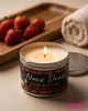 Bougie de massage sensuelle senteur vin pétillant à la fraise allumée