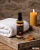 Huile de massage sensuelle et gourmande senteur miel crémeux, présentation produit salle de bain